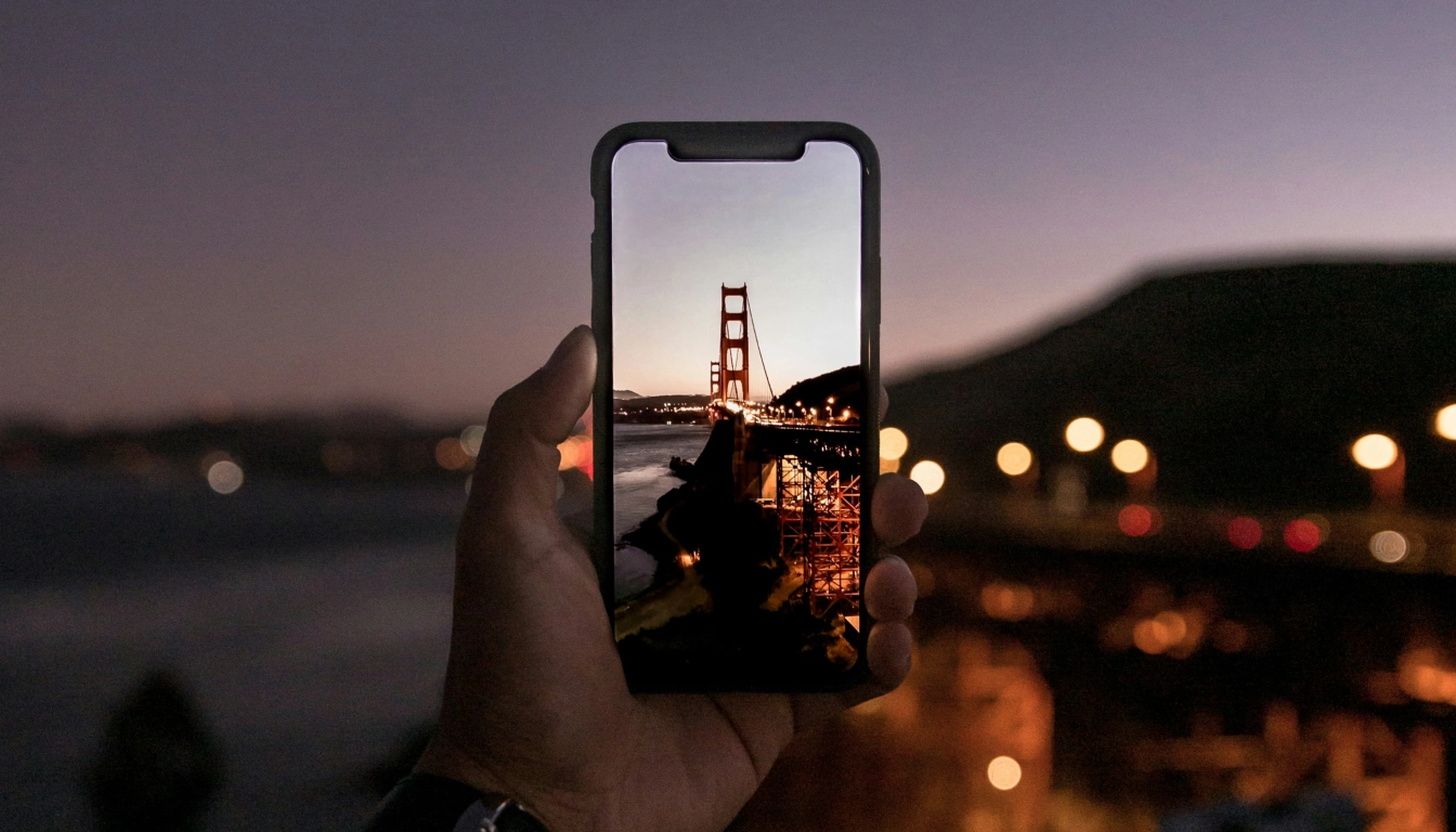 Photo on the smartphone. Bridge. Sunset.